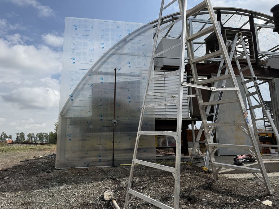 Mounting a curved 4-layer polycarbonate panel to a high-tunnel frame